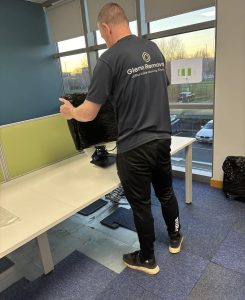 Team moving office equipment during a commercial relocation in Nuneaton